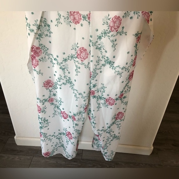 Eloquii|White chiffon floral halter jumpsuit with wide leg, open leg detail•••22 - Picture 8 of 17